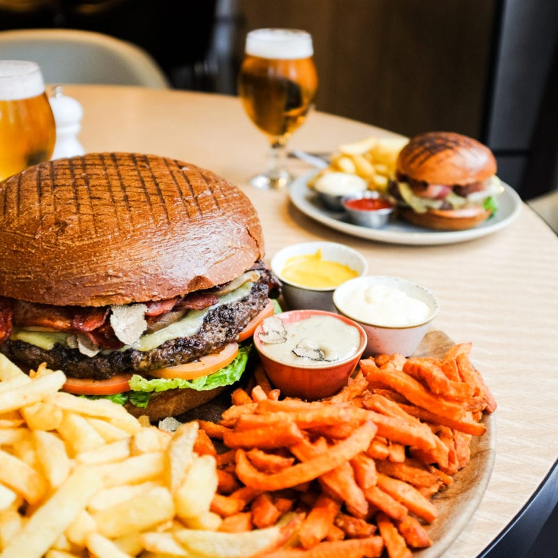 A 2.2g beef burger served with chips, mushrooms, black truffle, bacon, sweet potato fries and cheese