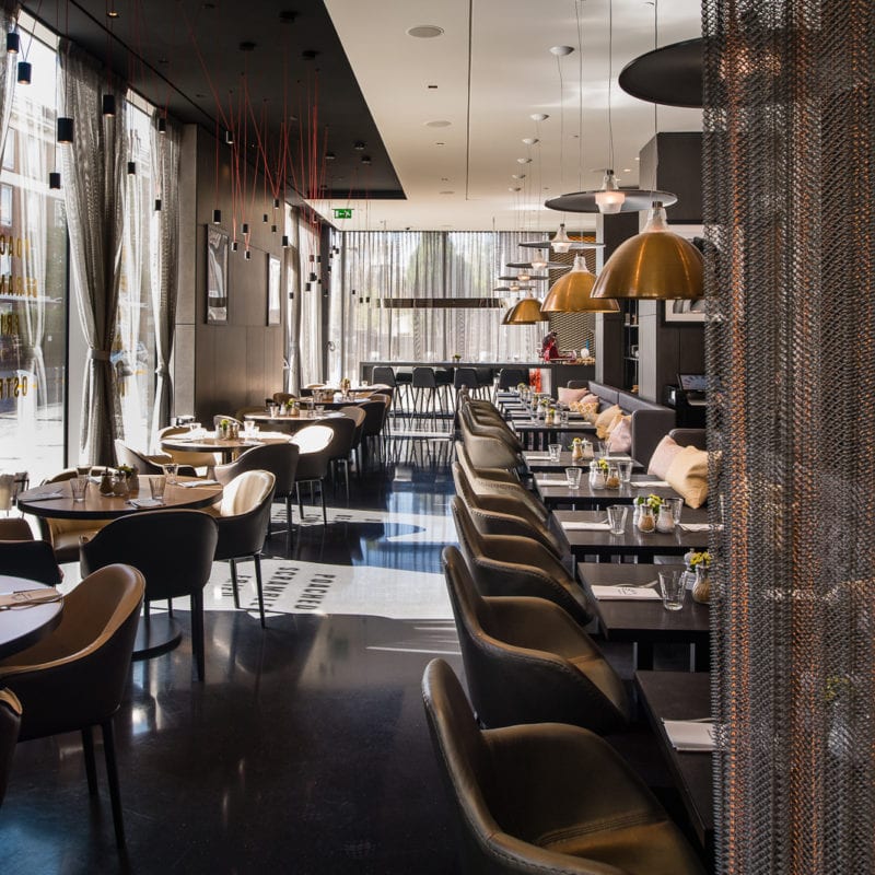 A long shot of the Florentine Restaurant dining area with light shining through the windows